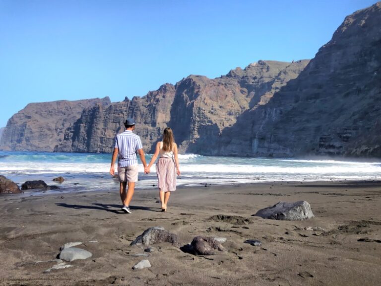 Walking in the beach with a view of Los Gigantes cliffs